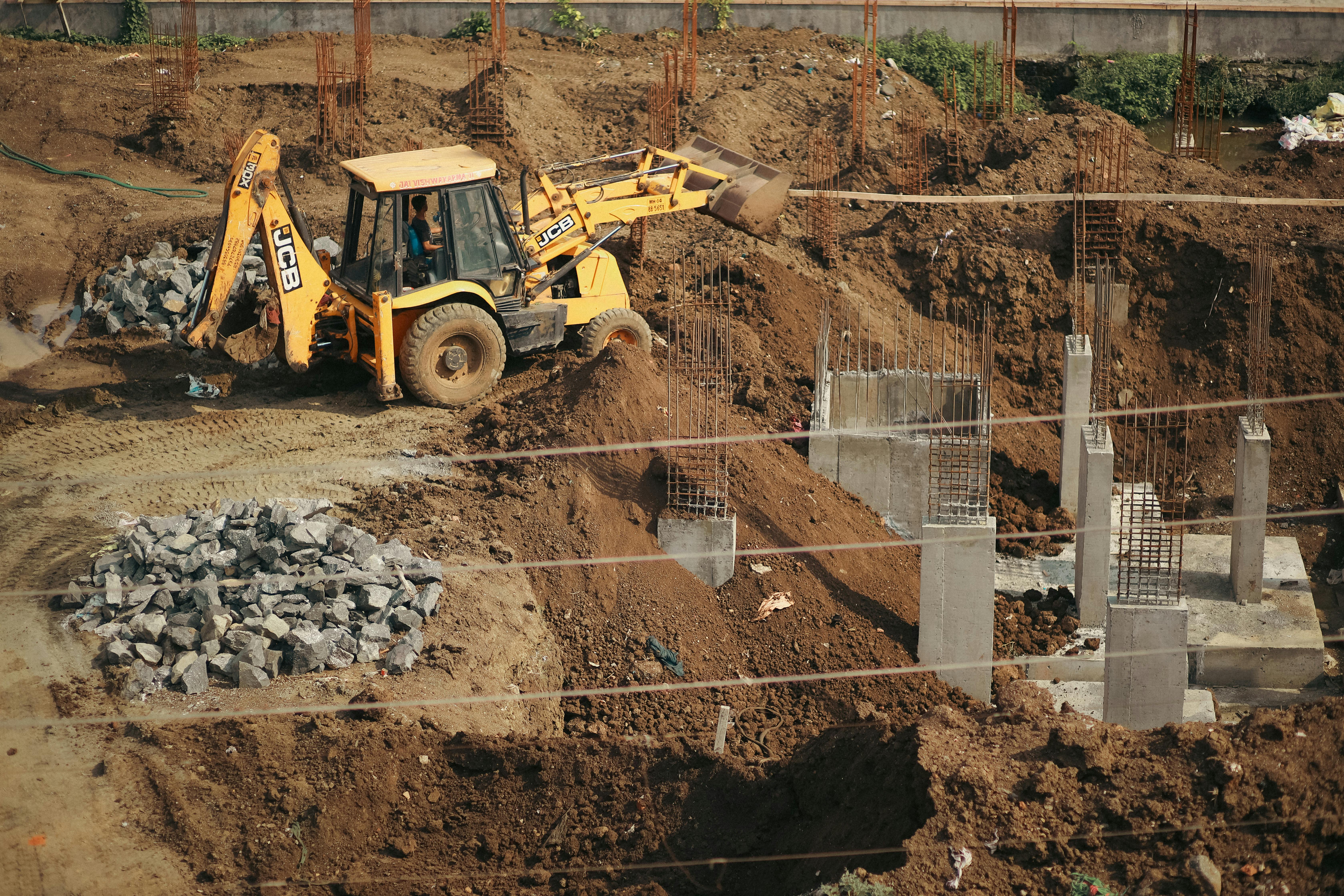 Foundation preparation and concrete footing installation for a building project